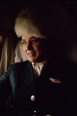 1966, Якустк, Якутия, СССР - Стюардесса Аэрофлота с коронками на зубах, полет из Иркутска в Якутск. Россия. - Дин Конгер.<br />1966, Yakutsk, Yakutia, USSR --- An Aeroflot stewardess with capped teeth during a flight from Irkutsk to Yakutsk. Russia --- Image by © Dean Conger/CORBIS